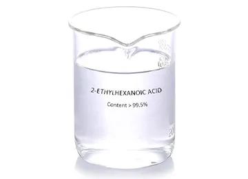 2-Ethylhexanoic acid product sample in a clear glass beaker